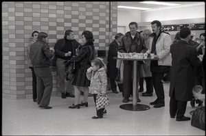 People gathered at a snack bar while waiting at JFK airport