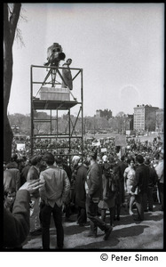 Resistance on the Boston Common: shot of crowd of antiwar demonstrators and platform erected for a television camera