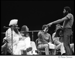 Yogi Bhajan (far left) on stage on the last night of the Kohoutek Celebration of Consciousness