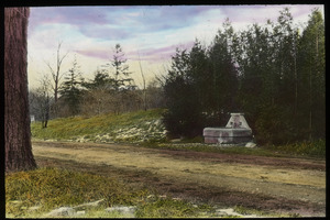 Stone (drinking trough?) by the side of a dirt road