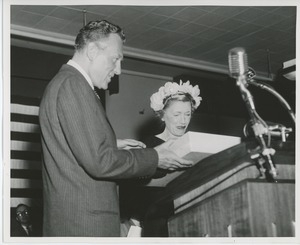 Helen Menken behind podium with unidentified man at Institute Day