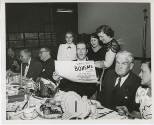 Unidentified man and clients singing at Thanksgiving dinner