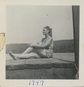 Bernice Kahn seated on dock in Alton Bay