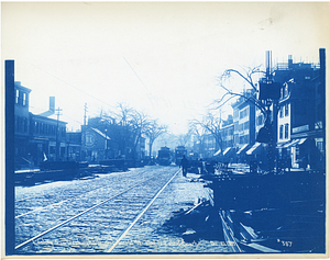 Looking south on Washington Street near Arnold Street, steel laid out ahead of work