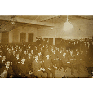 Men seated for presentation