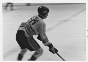 A Suffolk University men's hockey player during a game, 1977