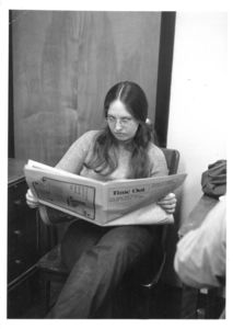A Suffolk University student reads "Time Out" in the recreation hall