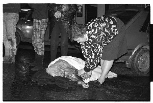Car accident, Co. Down, showing injured woman receiving first aid from Ambulance crew
