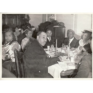 Reverend Dr. Wm. Frederick Fisher seated at a table