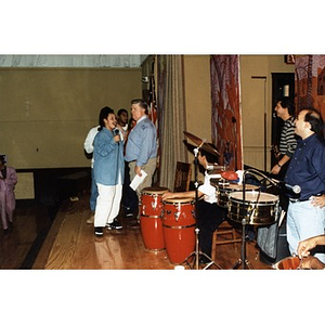 Areyto musicians pause during a music and dance program at a school.