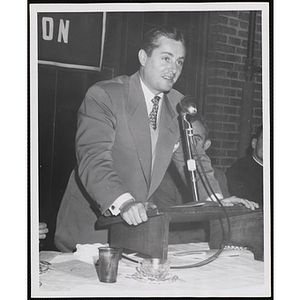 A man speaks from the podium at an awards event held by the Boys' Clubs of Boston and the Knights of Columbus Bunker Hill Council