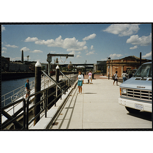 A woman stands on a pier in Charlestown