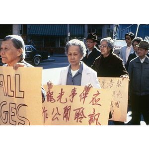 Demonstrators march to support Long Guang Huang