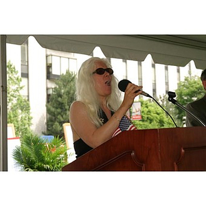 Tish Standencki sings at the Veterans Memorial dedication ceremony