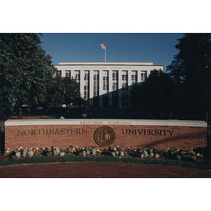 Northeastern University sign in front of Krentzman Quad and Ell Hall