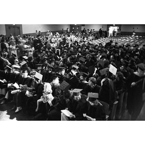 Graduating students sit in the crowd during School of Law commencement