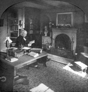 Portrait of Amos Bronson Alcott, sitting in a chair in his study, facing right, A. Bronson Alcott House, Concord, Mass., undated
