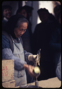 Old woman weighing