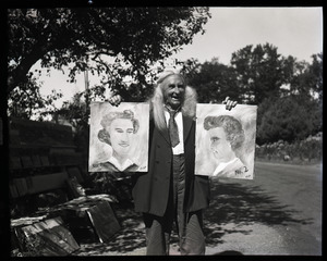 Albion L. Clough displaying paintings for sale by the side of a road
