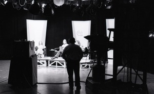 Commune members at the WGBY Catch 44 (public access television) interview: wide shot of the stage and camera operators