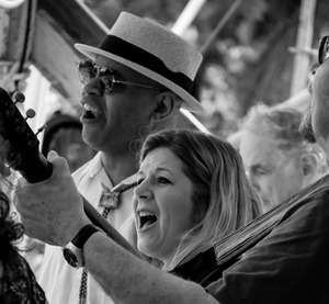 Guy Davis (harmonica), Dar Williams (guitar), and Tom Paxton (obscured) (from left) performing on the Rainbow stage at the Clearwater Festival