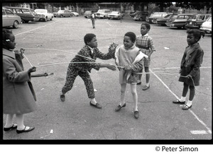 Children playing in a parking lot, Liberation School, Boston, Mass.
