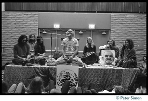 Ram Dass and associates on stage during an appearance at the College of Marin