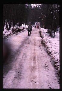 Nina Keller walking down snowy road, Wendell Farm