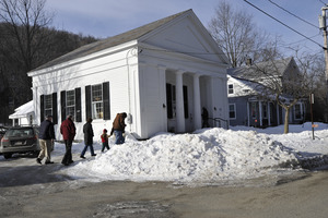 Aftermath of the Congregational Church fire in West Cummington, Mass.: exterior view of parishioners approaching the Parish House