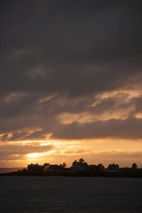 Houses on a point of land at sunset