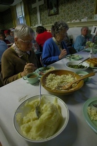 Church supper at the First Congregational Church, Whately: diners eating at their table