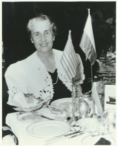 Dr. Marie S. Gutowska sitting at Captain's Table on ship "Batory"