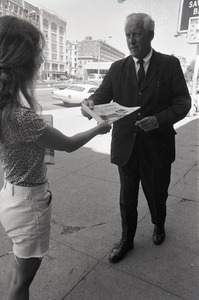 Boston Phoenix promotional photos: Phoenix hawker handing paper to man