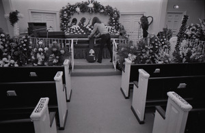 Duane Allman's funeral: musicians setting up with Duane Allman's casket in foreground, from left: Delaney Bramlett, Barry Oakley, Butch Trucks, and Thom Doucette