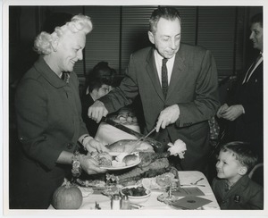 Margaret Milbank Bogert and Mr. Burrows putting together a plate for a client at Thanksgiving celebration