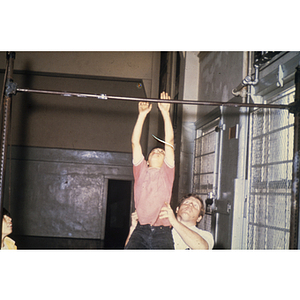 Child using a pull up bar