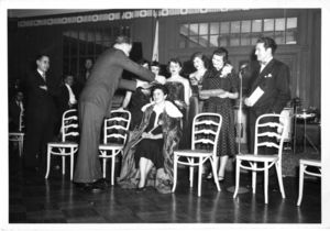 Suffolk University students watch as Miss Suffolk is crowned by President Robert J. Munce (1955-1960), 1952