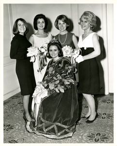 Miss Suffolk, seated with other candidates at a Suffolk University dance, 1966