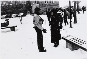 Students talking on wintry Boston College campus