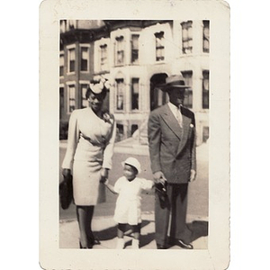 Inez Irving poses with a man and small child