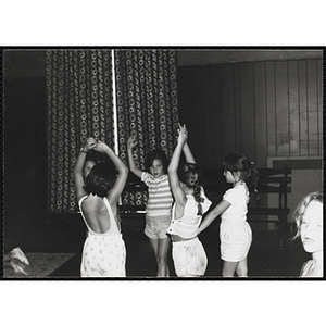 A group of girls dance at a carnival