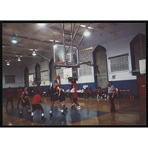 A player pulls down a rebound during a basketball game