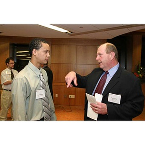 Ted English converses with Odalis David Polanco at the Torch Scholars dinner