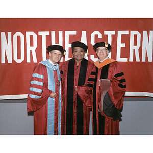 Maya Angelou poses with President Curry and Joseph Heney at the fall commencement ceremony