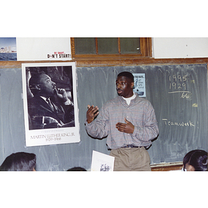 Unidentified man speaking in classroom