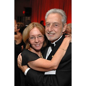 A couple dancing at a dinner honoring members of the Huntington Society