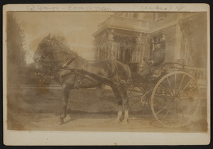 Coach driver and carriage in front of the Elisha Dillingham Bangs House, Central Street, Winchester, Mass., undated
