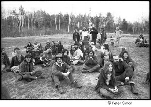 May Day at Packer Corners commune: group sitting and standing in a field