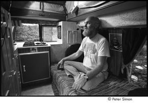 Ram Dass in his van, preparing to meditate