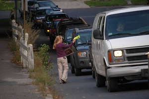 Protest against a pornographic video store in Northampton: protester handing out fliers to cars on North Street